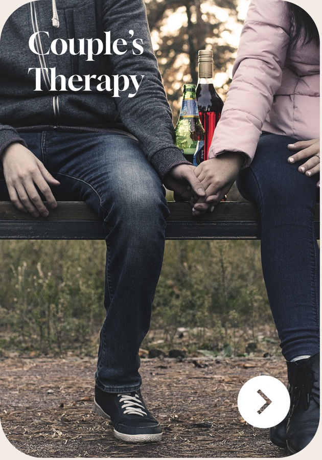 A couple sitting together and holding hands